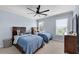 Bright bedroom featuring two beds, large windows, and a spacious feel at 5995 Ettington Dr, Suwanee, GA 30024