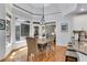 Sunlit breakfast nook with a dining table and chairs, next to the kitchen at 5995 Ettington Dr, Suwanee, GA 30024