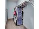 Well-organized walk-in closet with hanging rods and ample storage space at 5995 Ettington Dr, Suwanee, GA 30024