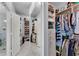Spacious walk-in closet with ample storage and shelving for organization at 5995 Ettington Dr, Suwanee, GA 30024