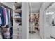 Well-organized closet featuring built-in drawers, shelves, and a full-length mirror at 5995 Ettington Dr, Suwanee, GA 30024
