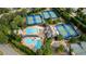 Overhead shot of community pool and tennis courts provides ample recreation and social opportunities at 5995 Ettington Dr, Suwanee, GA 30024