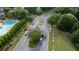 A gated community entrance with a pool area visible, offering security and luxury amenities at 5995 Ettington Dr, Suwanee, GA 30024