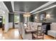 Elegant dining room with a coffered ceiling, a grand chandelier, and refined decor, perfect for formal gatherings at 5995 Ettington Dr, Suwanee, GA 30024