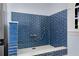 Tiled dog shower with blue subway tile and hand held shower fixture at 5995 Ettington Dr, Suwanee, GA 30024