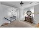 Inviting hallway with stylish lighting, a decorative table, and stairway access at 5995 Ettington Dr, Suwanee, GA 30024