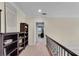 Hallway with detailed molding, bookshelf, and a clear view into the adjacent rooms at 5995 Ettington Dr, Suwanee, GA 30024