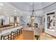 Kitchen and breakfast nook area with bar stool seating and dining table at 5995 Ettington Dr, Suwanee, GA 30024