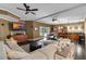 Cozy living room featuring a wet bar, dark hardwood floors, and comfortable seating at 5995 Ettington Dr, Suwanee, GA 30024