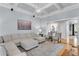 Inviting living room with coffered ceilings, neutral color palette, and hardwood floors at 5995 Ettington Dr, Suwanee, GA 30024