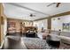 Spacious living room with a wet bar, dark hardwood floors, and neutral-toned furniture at 5995 Ettington Dr, Suwanee, GA 30024