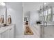 Bright bathroom with marble floors, glass shower and soaking tub at 5995 Ettington Dr, Suwanee, GA 30024