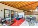 Rear patio with comfortable seating and views of the landscaped backyard at 5995 Ettington Dr, Suwanee, GA 30024
