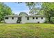 The backyard has a grassy lawn and the home's exterior is painted white at 1780 Kinridge Rd, Marietta, GA 30062