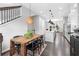 Open floor plan with dining area featuring dark wood table, black chairs, and seamless flow to the modern kitchen at 3933 Danube Ln # 224, Atlanta, GA 30339