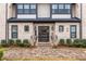 Brick building with a black door with side windows and black railings at 3933 Danube Ln # 224, Atlanta, GA 30339