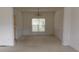 Elegant dining room with chandelier and wainscoting at 442 John Stewart Pl, Suwanee, GA 30024