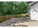 Expansive wooden back deck offers ample space for outdoor gatherings and enjoyment of the surrounding nature at 4745 Masters Ct, Duluth, GA 30096