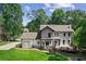 Two story home with deck and manicured lawn at 4745 Masters Ct, Duluth, GA 30096