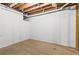 The unfinished basement area shows the exposed rafters, beams, and concrete floor at 4745 Masters Ct, Duluth, GA 30096