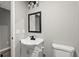 Powder room features modern vanity with new faucet and light fixture at 4745 Masters Ct, Duluth, GA 30096