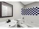 The renovated bathroom features tiled walls, a modern vanity, and a new toilet at 4745 Masters Ct, Duluth, GA 30096