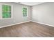 Bedroom featuring wood-look flooring and natural light at 4745 Masters Ct, Duluth, GA 30096