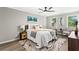 Bedroom with a ceiling fan, neutral colored walls, accent artwork, and light-colored floors at 4745 Masters Ct, Duluth, GA 30096