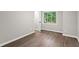 Bedroom featuring wood-look flooring and natural light at 4745 Masters Ct, Duluth, GA 30096