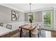 Bright dining room featuring a wooden table, modern chandelier, and stylish decor at 4745 Masters Ct, Duluth, GA 30096