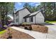 Two story home with a two-car garage, landscaping, and a walkway at 4745 Masters Ct, Duluth, GA 30096