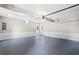A large 2 car garage space with walkout door and neutral paint at 4745 Masters Ct, Duluth, GA 30096