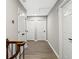 Hallway featuring wood floors, fresh paint and multiple door access to bedrooms and closets at 4745 Masters Ct, Duluth, GA 30096