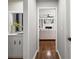 Hallway with hardwood flooring leading to the living room with fireplace at 4745 Masters Ct, Duluth, GA 30096