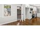 Bright eat-in kitchen with white cabinets, stainless steel appliances, and hardwood flooring at 4745 Masters Ct, Duluth, GA 30096