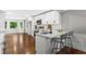 Bright, modern kitchen with white cabinets, stainless steel appliances, and a breakfast bar at 4745 Masters Ct, Duluth, GA 30096
