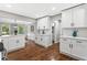 Spacious kitchen with white cabinets, quartz countertops, and modern fixtures at 4745 Masters Ct, Duluth, GA 30096