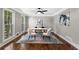 Bright office space featuring hardwood floors, contemporary furnishings, and natural light from large windows at 4745 Masters Ct, Duluth, GA 30096