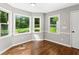 Cozy sun room with hardwood floors and multiple windows providing natural light at 4745 Masters Ct, Duluth, GA 30096