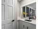 Wet bar with marble countertop, sink, and cabinet space next to the door at 4745 Masters Ct, Duluth, GA 30096