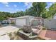 Backyard features a brick pathway, stone waterfall, and patio area, creating a serene outdoor space at 935 Bobcat Se Ct, Marietta, GA 30067