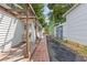 Exterior view of the home's side with a small patio and walkway at 935 Bobcat Se Ct, Marietta, GA 30067