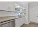Kitchen featuring granite countertops, modern appliances, and bright windows for a fresh and clean aesthetic at 935 Bobcat Se Ct, Marietta, GA 30067