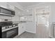 Kitchen with stainless steel appliances, granite countertops, and views to the living spaces at 935 Bobcat Se Ct, Marietta, GA 30067