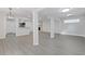 Large living room area with a white brick fireplace and gray flooring at 935 Bobcat Se Ct, Marietta, GA 30067