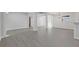 Bright and airy living area with gray floors, French doors, white brick accents, and convenient access to the kitchen at 935 Bobcat Se Ct, Marietta, GA 30067