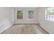 Bright sunroom with hardwood floors and large windows offering ample natural light at 935 Bobcat Se Ct, Marietta, GA 30067