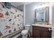 Bathroom featuring a vanity with granite countertop, decorative shower curtain, and fox decor at 108 Spring View Br, Dallas, GA 30157