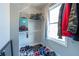 Well-organized closet with shelves, rods, and a variety of shoes, luggage and clothing, offering ample storage at 108 Spring View Br, Dallas, GA 30157