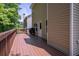 Inviting back deck with a grill, offering a peaceful spot for outdoor dining and entertaining with nature views at 108 Spring View Br, Dallas, GA 30157